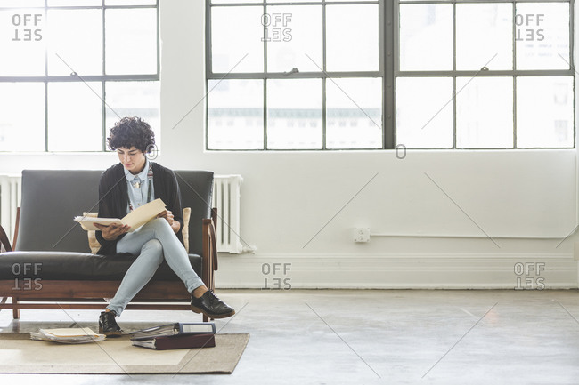 Woman going over files in an office
