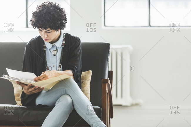 Woman reading files in an office