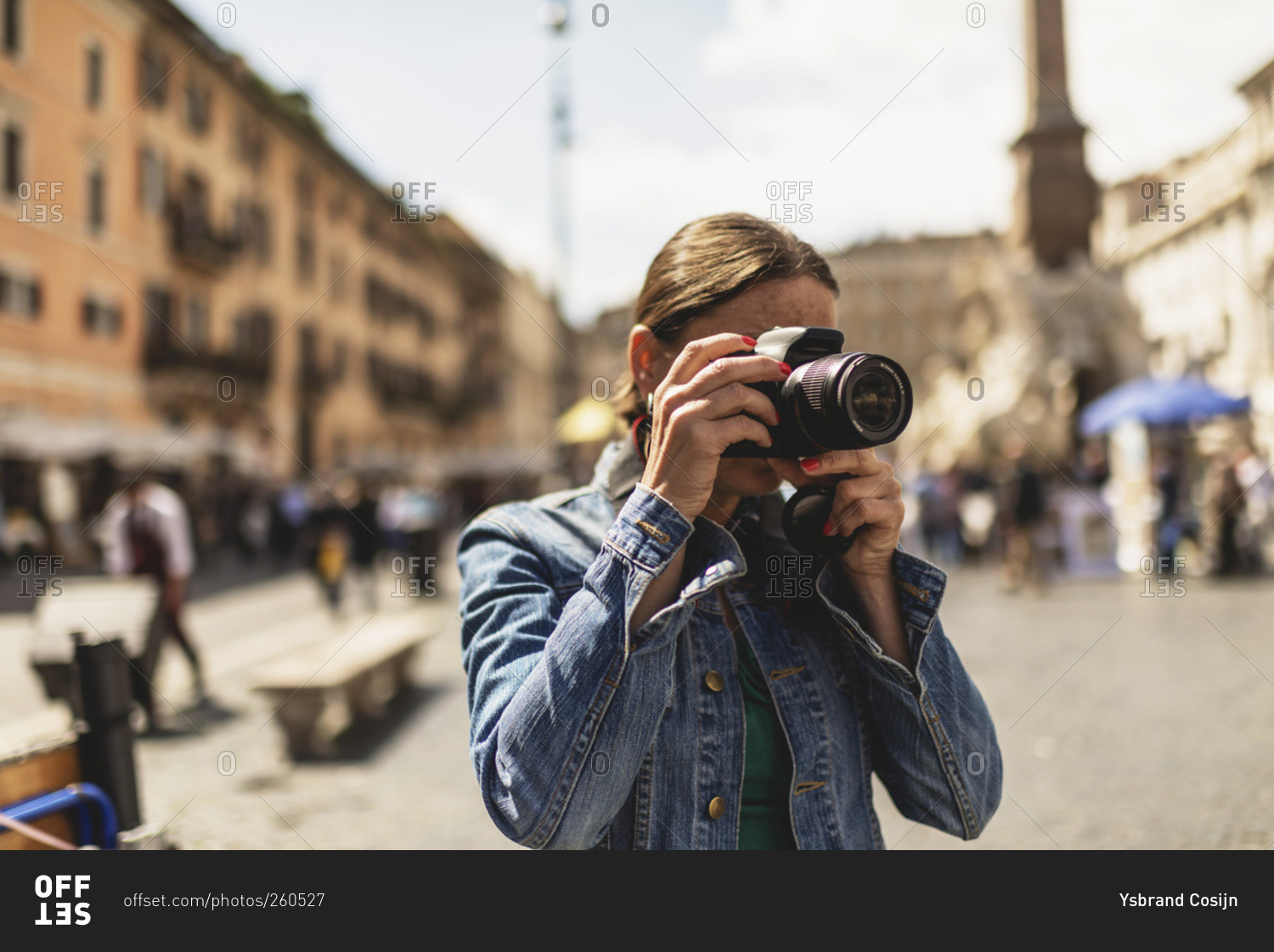 Tourist photographing architecture in Rome, Italy