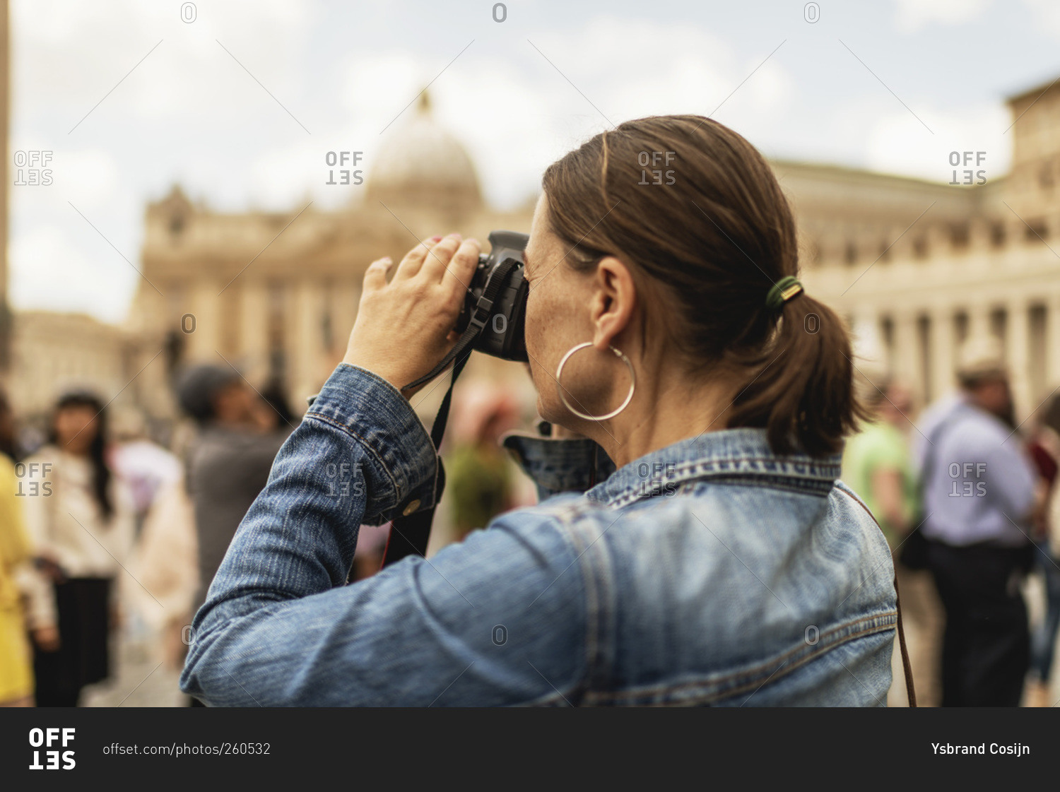 Female tourist photographing architecture in Rome, Italy