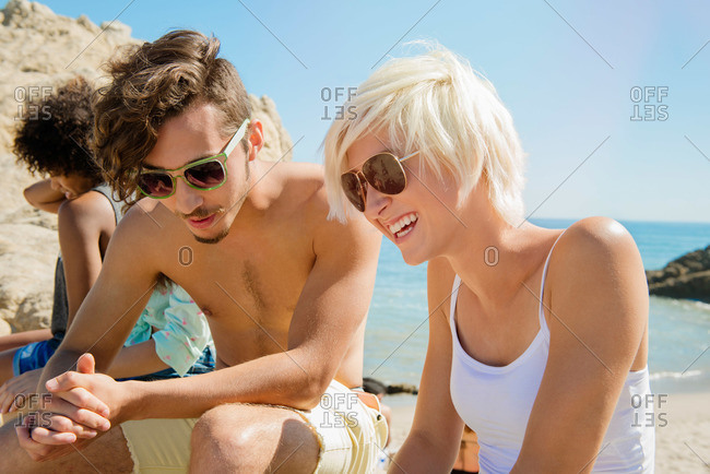 Group of friends having fun at the beach