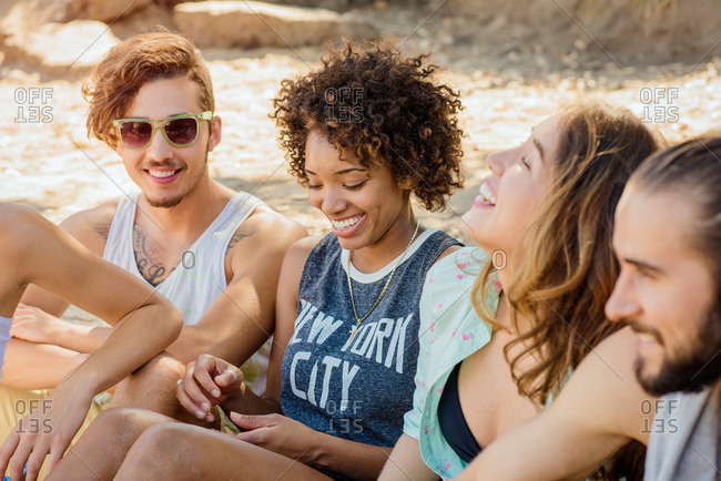Group of young friends having fun at the beach