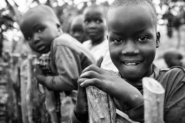 Children looking over a fence