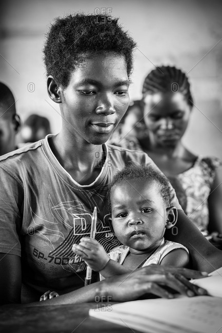 Woman and child in a literacy and numeracy development for youth program