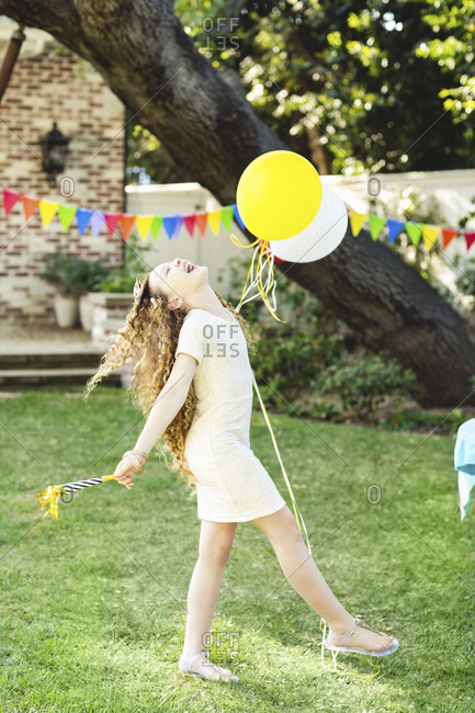 A laughing girl at a birthday party