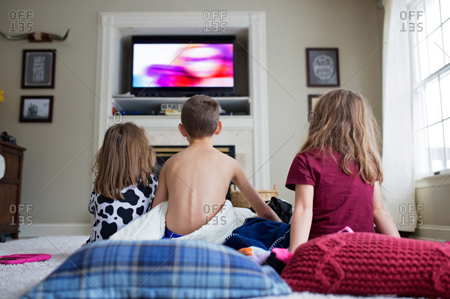 Kids Watching Tv Sitting On Floor Stock Photo Offset