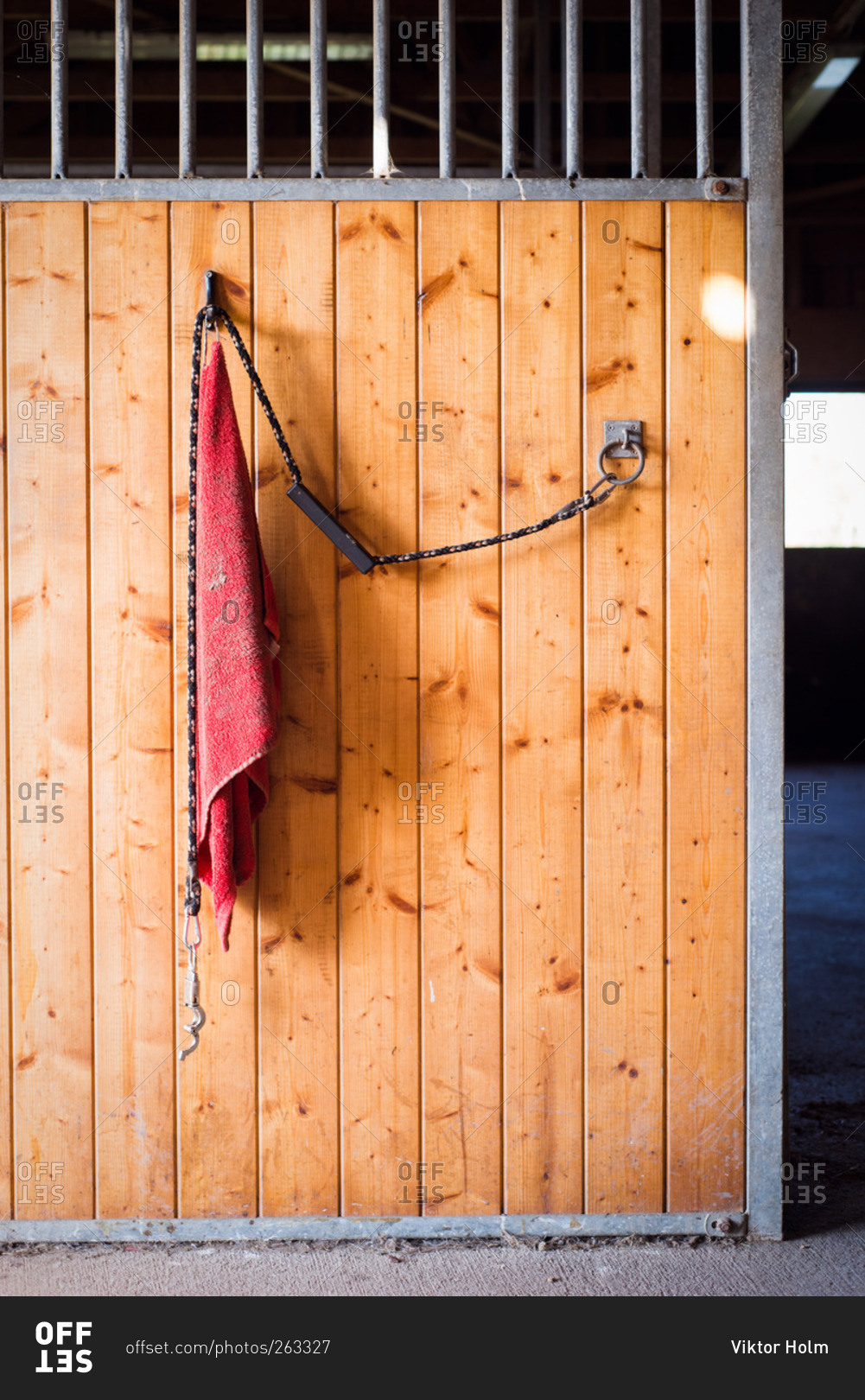 Lead rope and towel hanging in a horse barn