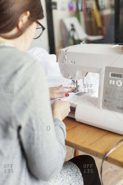 Woman using a sewing machine
