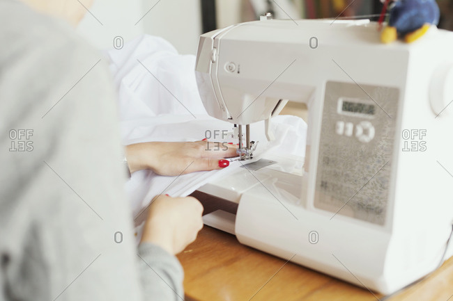 Close up of a woman sewing