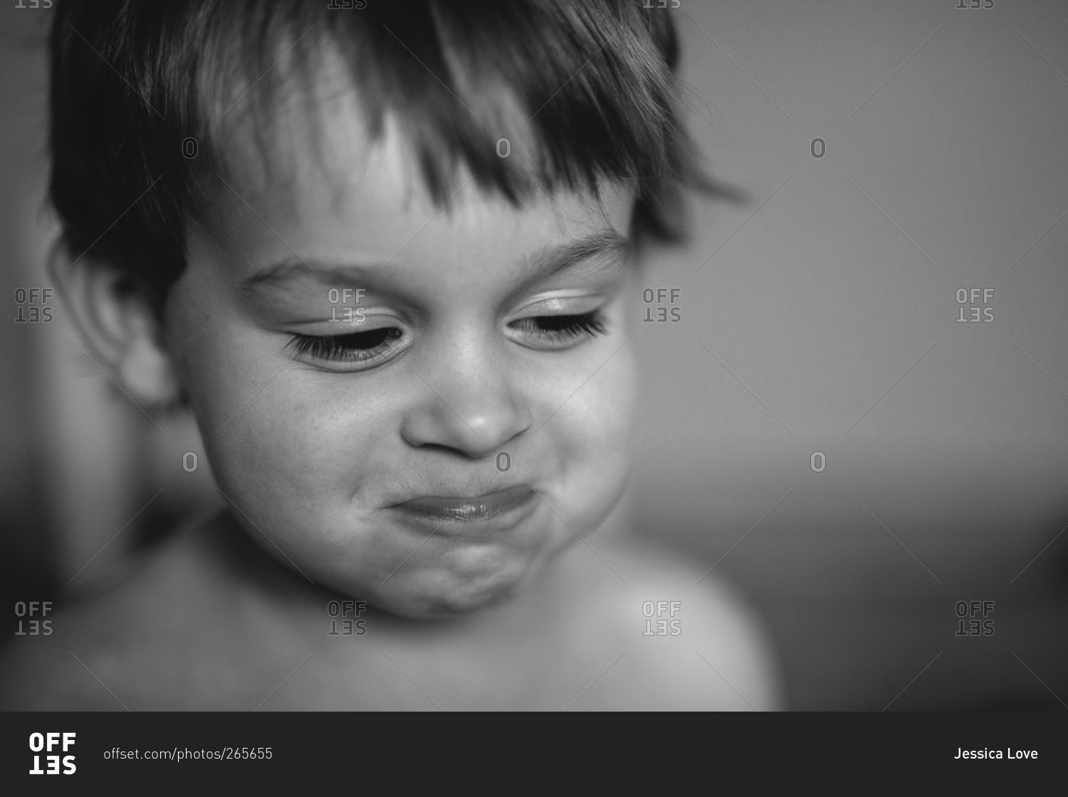 Black and white portrait of smiling little boy stock photo - OFFSET