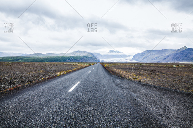 Desolate road through the Icelandic tundra