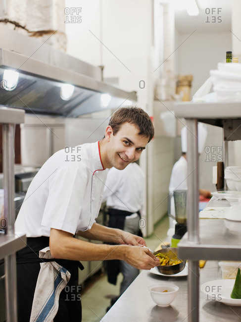 Siem Reap, Cambodia - February 24, 2009: Young French Executive Chef Alexis Voisin preparing food in the kitchen at La Residence d'Angkor, Siem Reap, Cambodia