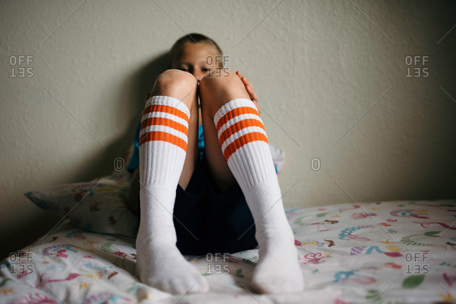 Boy wearing knee-high tube socks stock photo - OFFSET