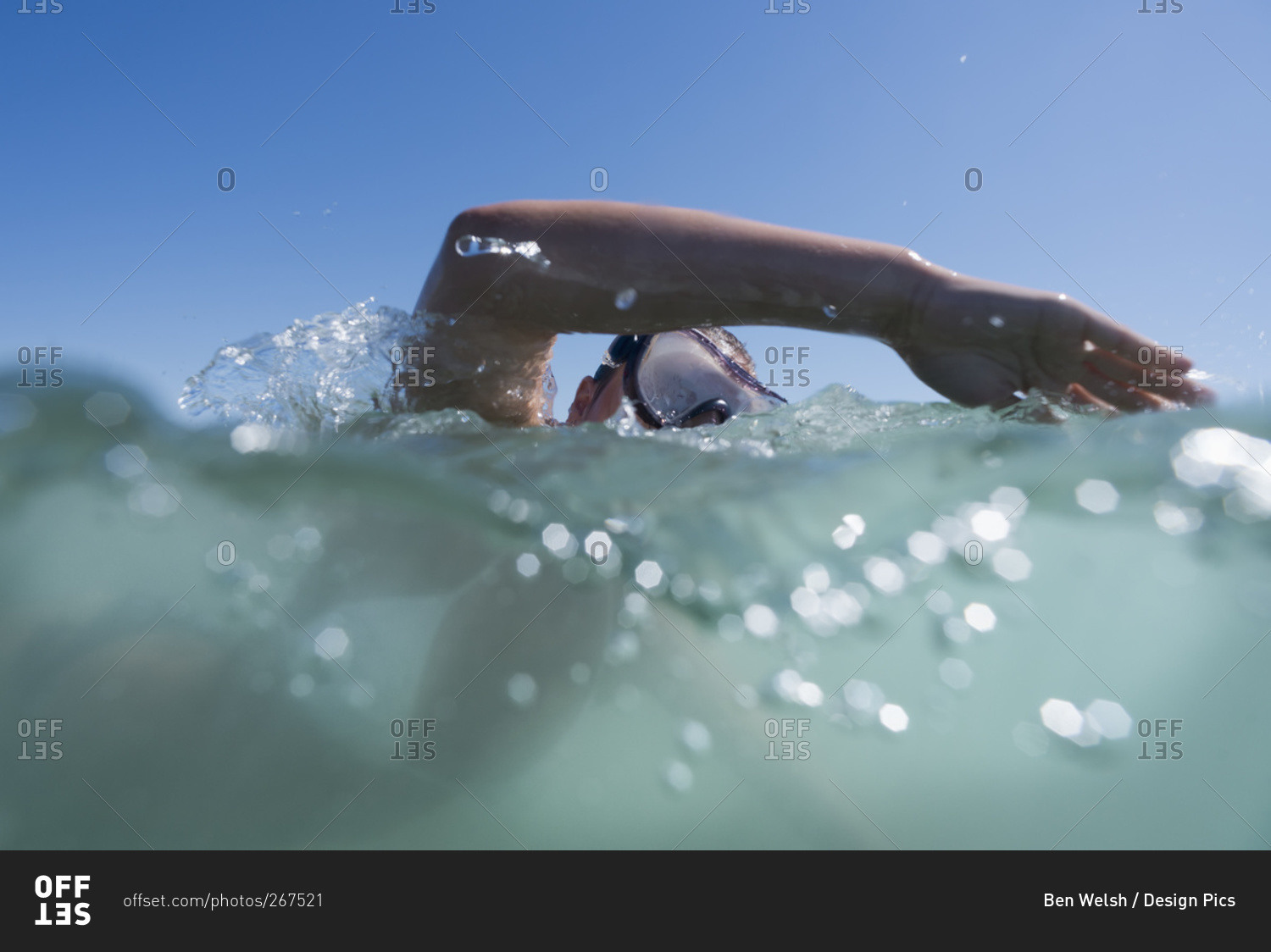 A person swimming with goggles on the surface of the water, Tarifa, Cadiz, Andalusia, Spain