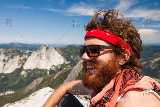 Climber and explorer, wearing a bandana and sporting a thick red beard