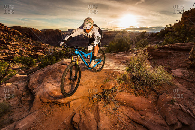A man mountain biking on the Hymasa trail, Moab, Utah