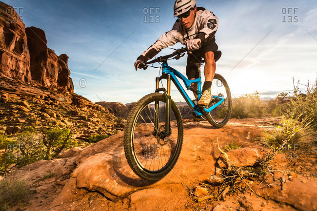A man mountain biking on the Hymasa trail, Moab, Utah