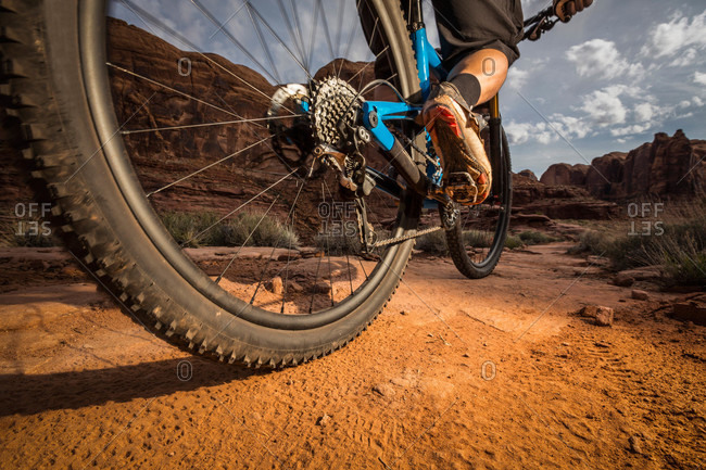 A man mountain biking on the Hymasa trail, Moab, Utah
