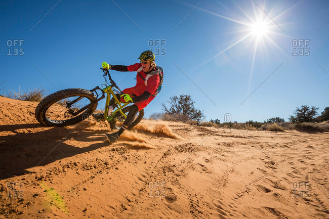 A man mountain biking, Moab, Utah