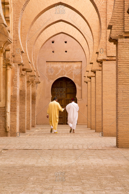 Men walking toward mosque door, the great Mosque of Tinmal, Marrakech