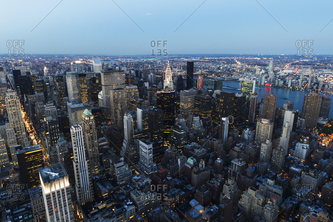 New York City, New York, United States - September 6, 2013: Panoramic view of the skyscrapers and the East River at dusk, as seen from the Empire State Building, New York City, New York, United States