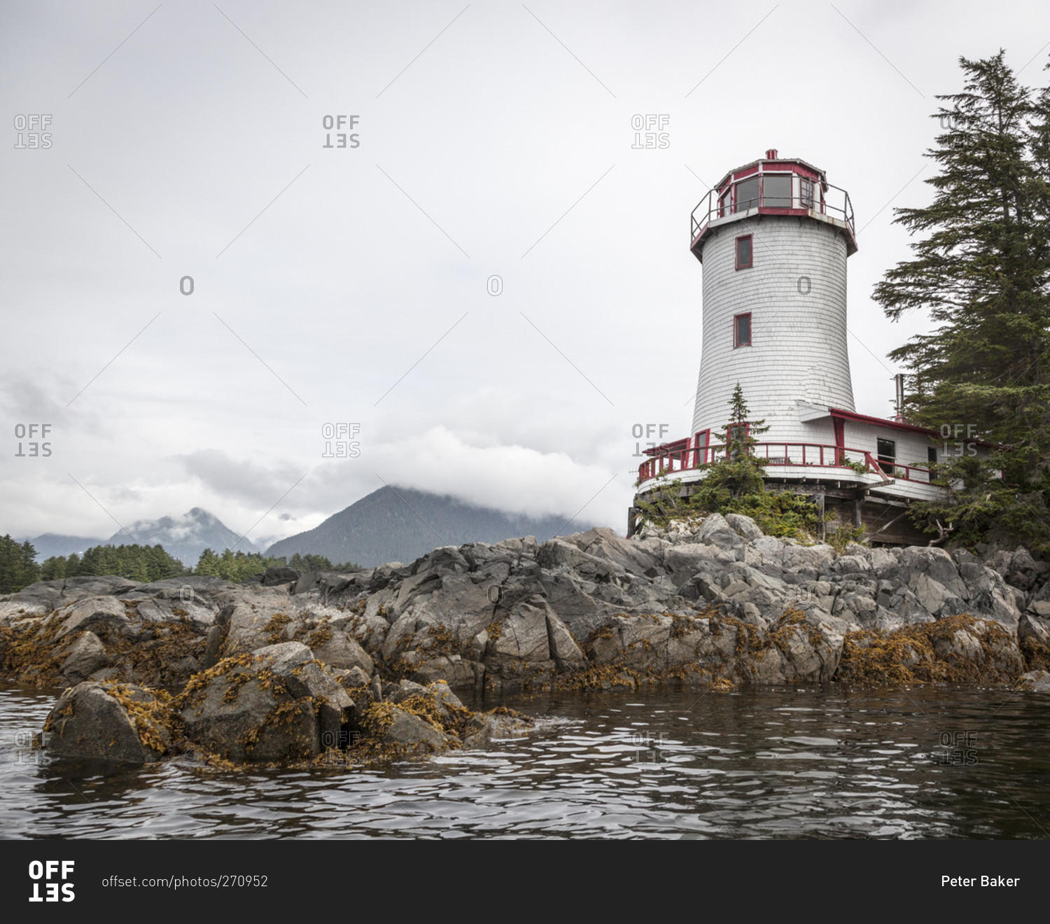 Red and white Rockwell Lighthouse in Sitka, Alaska stock photo OFFSET