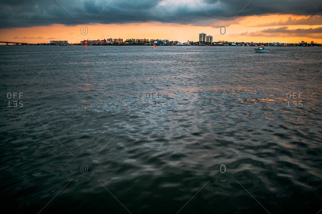 Distant skyline across a bay at sunset