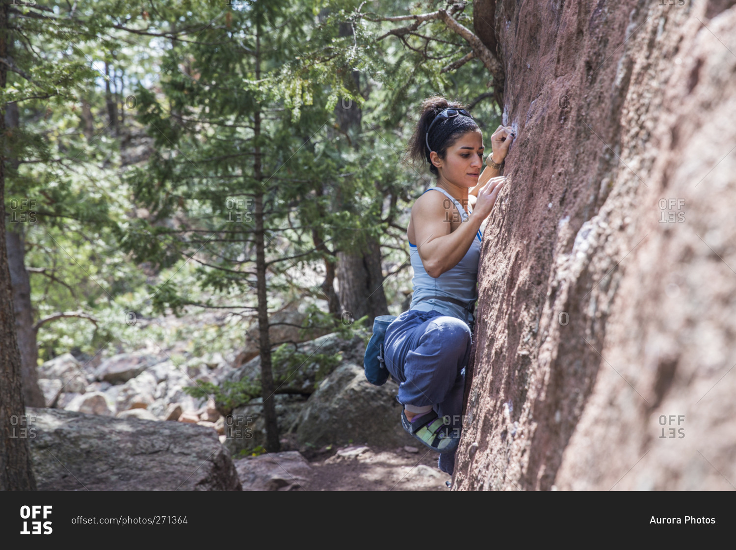 Strong female trying hard on climb in Boulder, Colorado