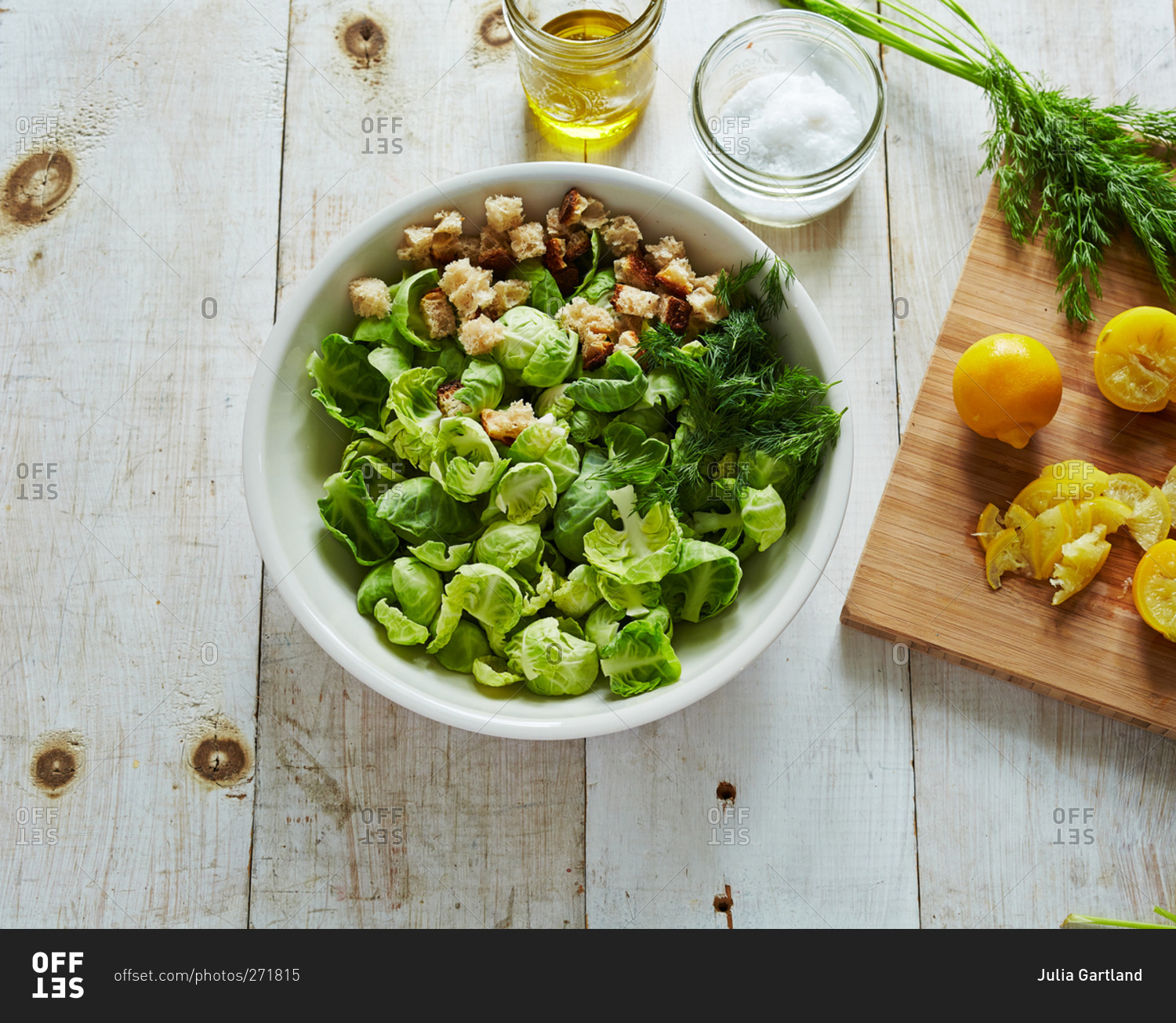 Overhead view of Brussels sprout leaf salad with lemon and croutons