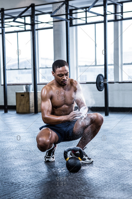 man working out in gym stock photos - OFFSET