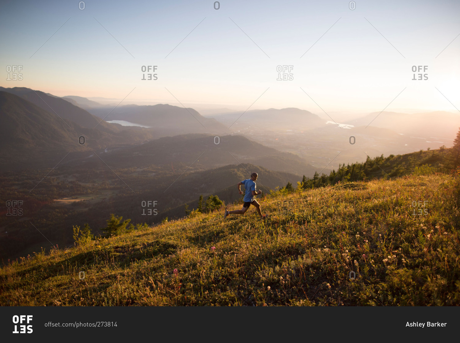 Man jogging up hill in remote mountain setting