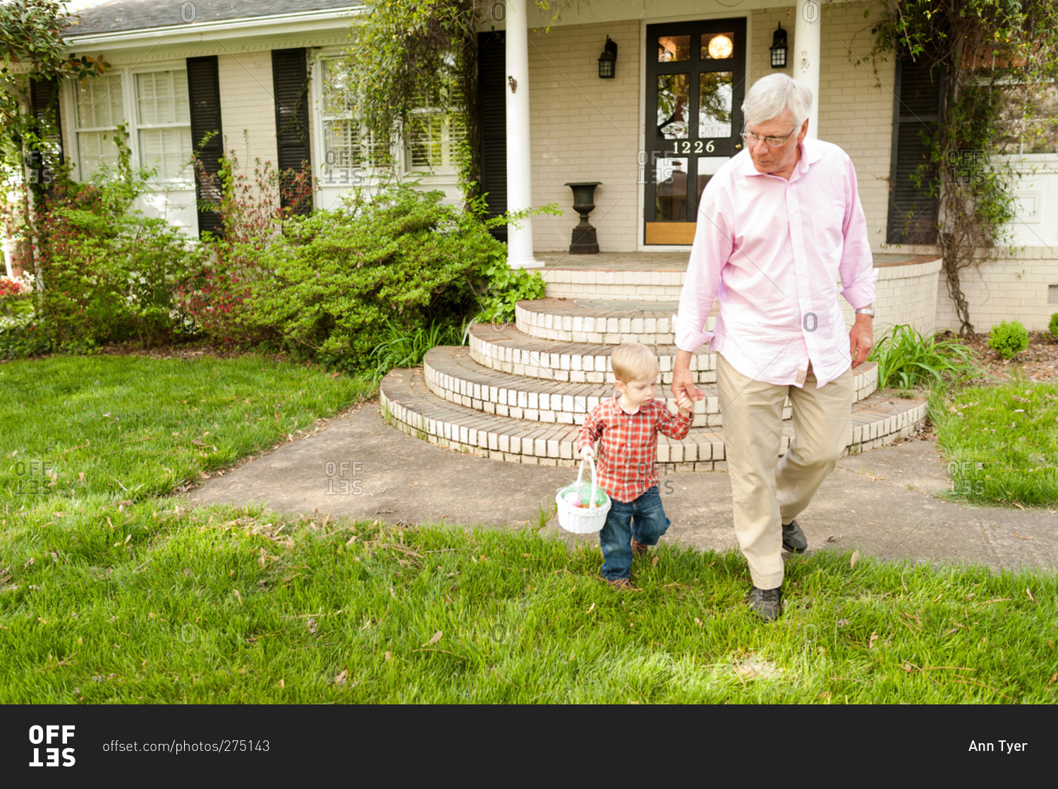 Grandfather and grandson holding hands on Easter