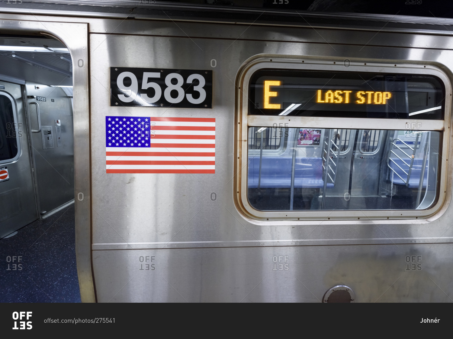 Last stop sign on subway train carriage, NYC stock photo - OFFSET
