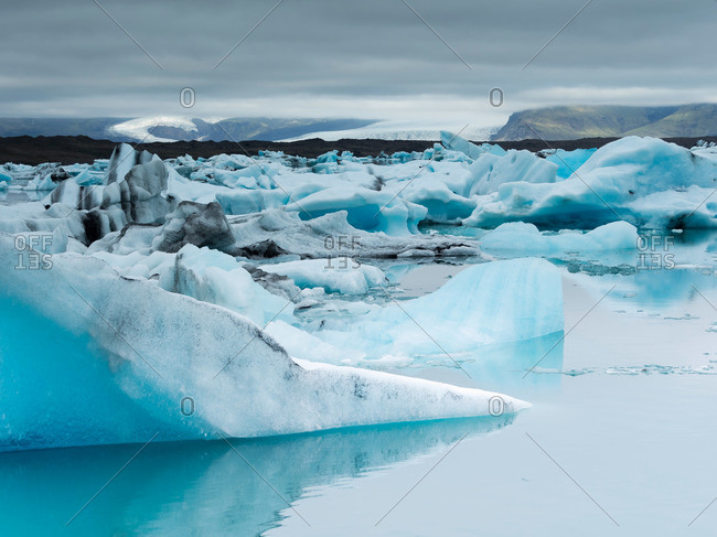 Glacial lake on the edge of Vatnajokull National Park at the head of the Breidamerkurjokull glacier, created after the glacier started receding from the edge of the Atlantic Ocean