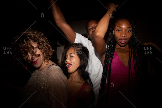 people dancing at a house party