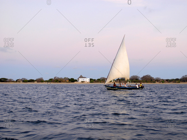 Lamu island, Kenya -  Tourists on a dhow sailing boat