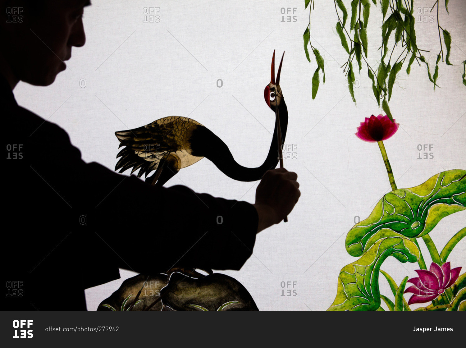 Man painting a bird on a screen