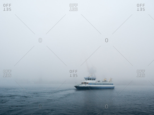 Ferry boat on foggy waters in Gothenburg, Sweden