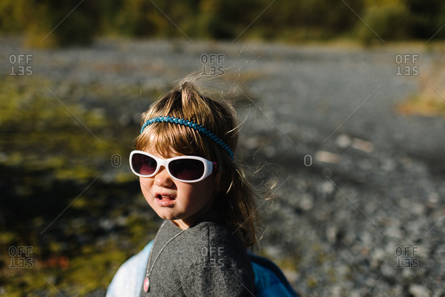 Portrait of a little girl on a gravel path