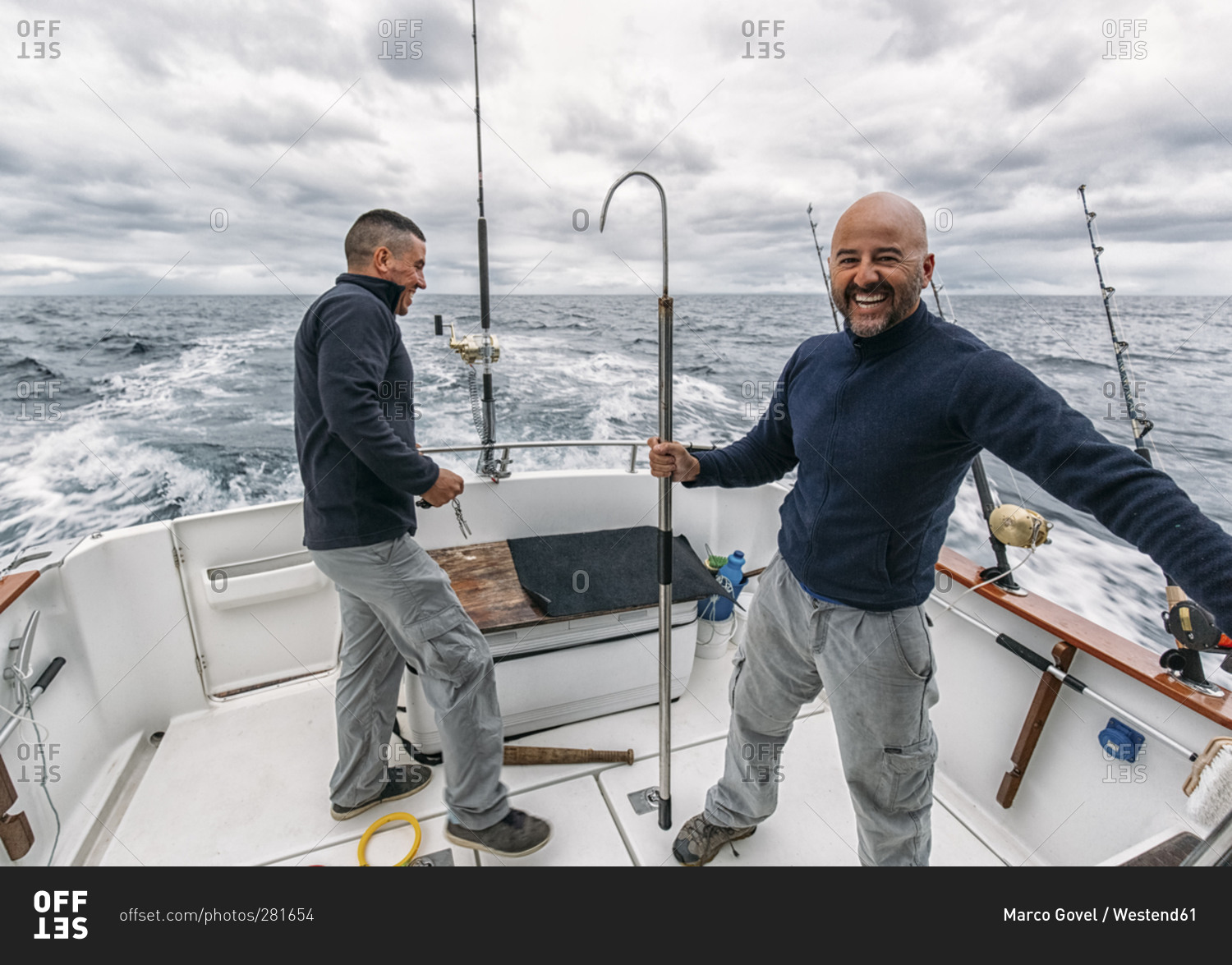 Fishermen on fishing boat on Cantabrian Sea