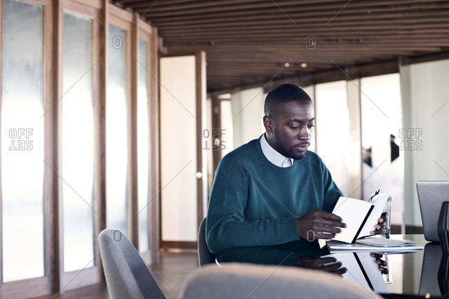 Office worker reading in an open office