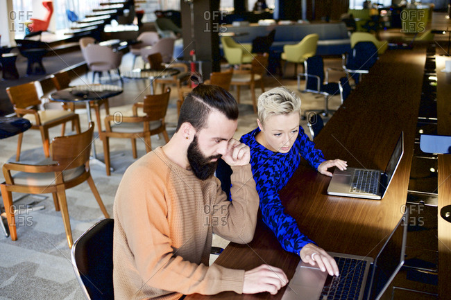 Coworkers working together in an open office
