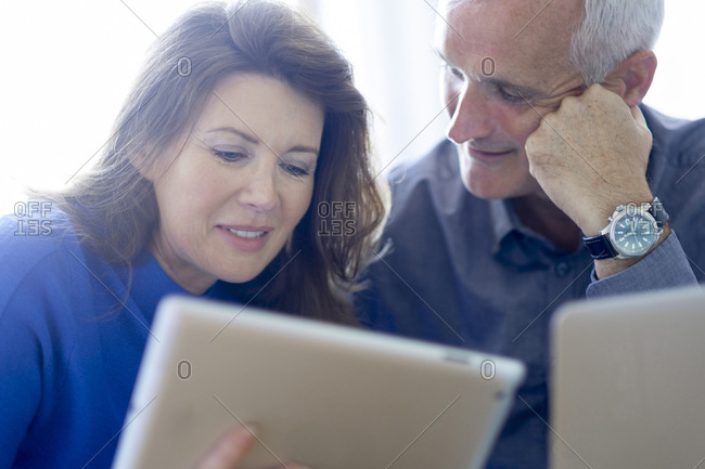 Couple looking at a smart tablet together