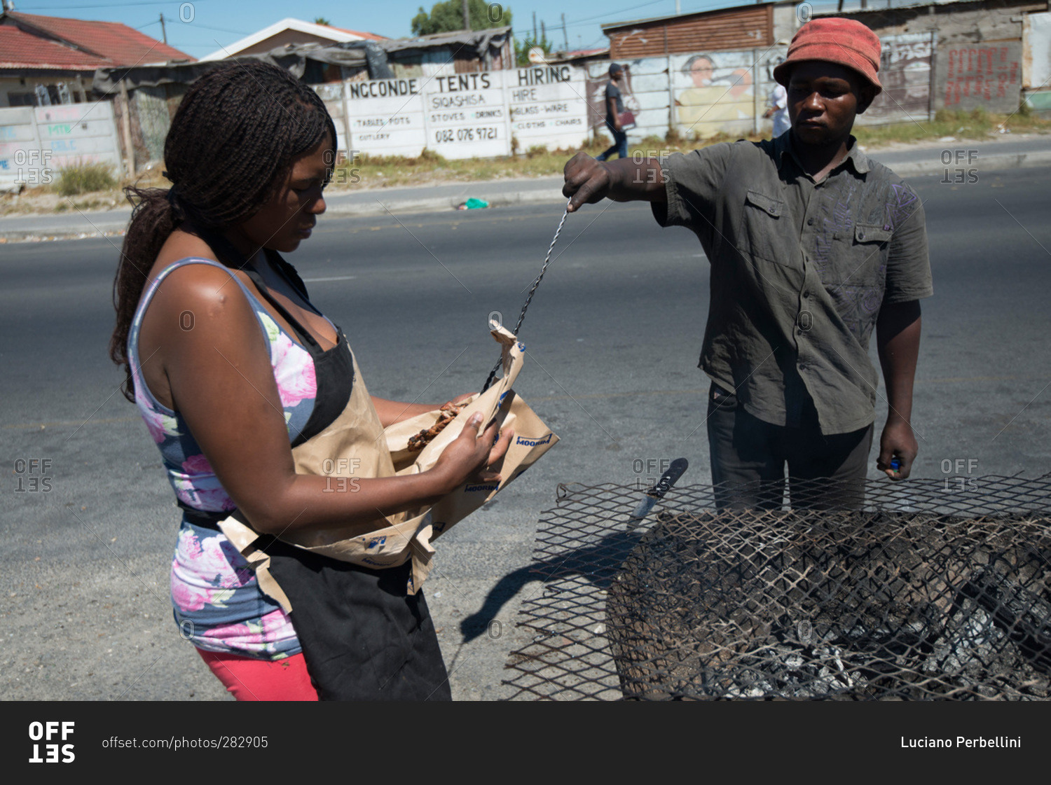 Cape Town, South Africa - February 17, 2015: Man and woman making street food, Cape Town, South Africa