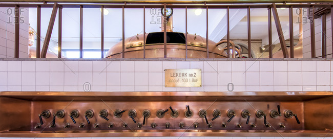 October 6, 2015: Close-up of copper sink and nozzles inside the  Heineken Brewery in Amsterdam