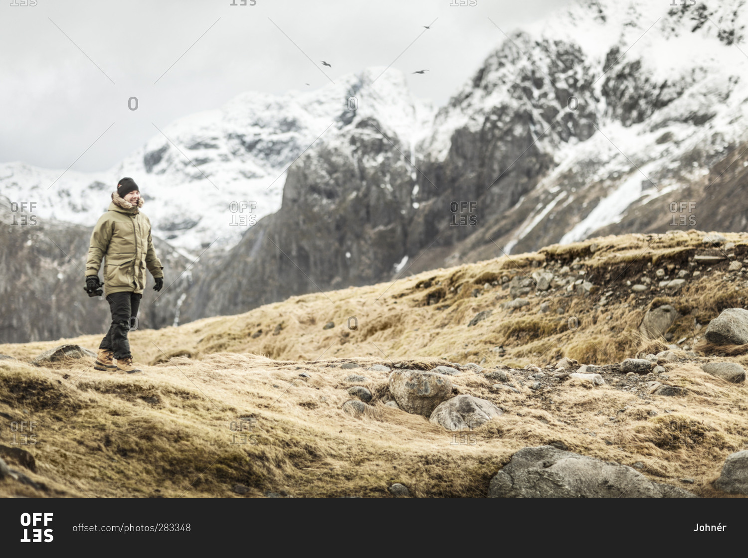 Woman hiking in mountains, Lofoten
