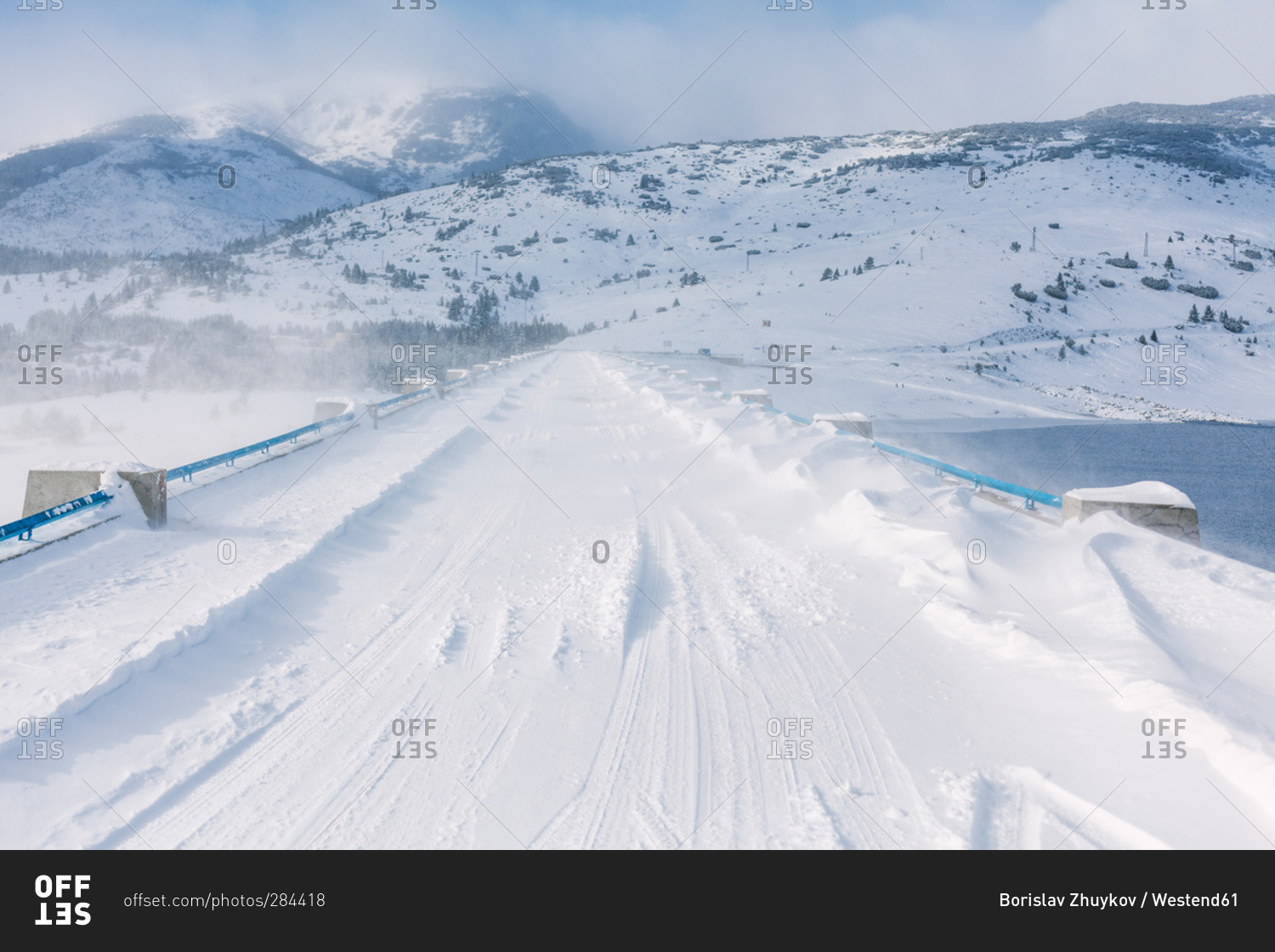 Snowy bridge during cold windy winter, Belmeken Dam, Rila Mountains, Bulgaria