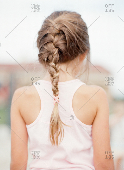 Rear view of blonde girl with braided hair