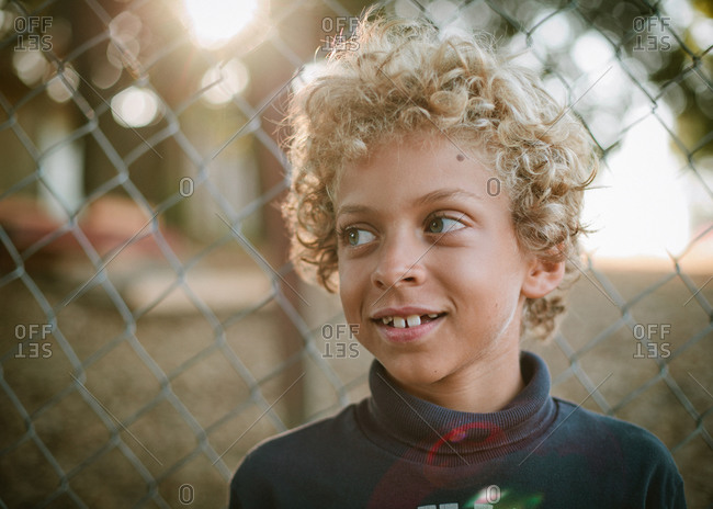 Young Boy With Blonde Curly Hair Stock Photo Offset