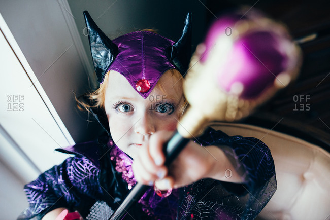 Young girl in wicked queen Halloween costume